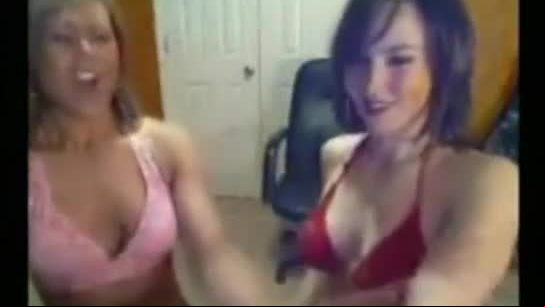 Two fitness girls touching each other on webcam